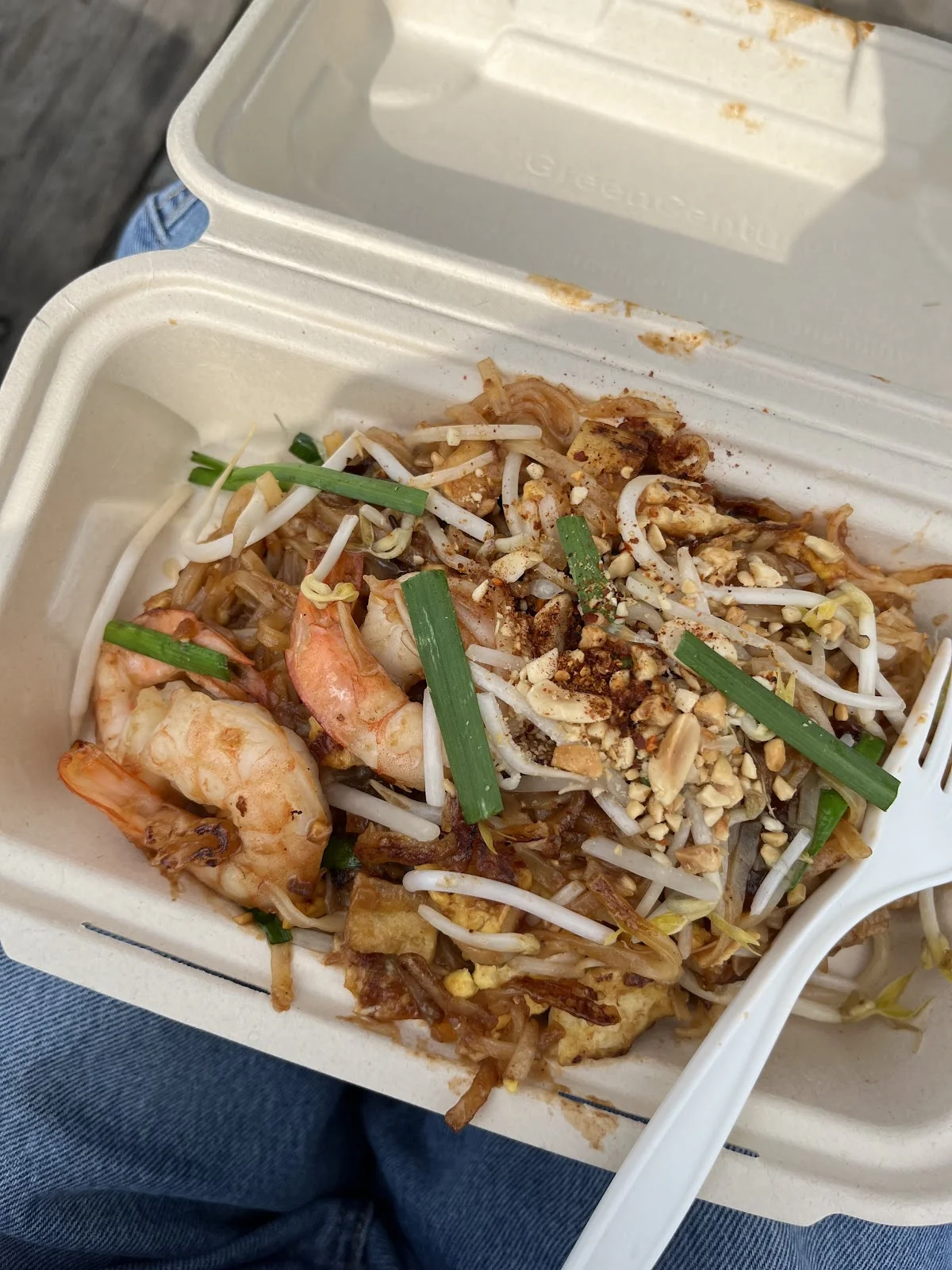 Pad Thai noodles served in a takeout container from Super Thai food truck